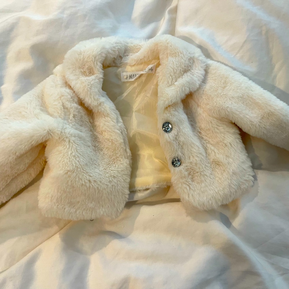 white faux fur coat